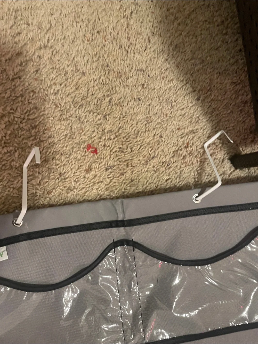 A hat holder that hangs on your door with 3 hooks great